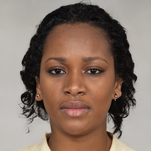 Neutral black young-adult female with medium  black hair and brown eyes