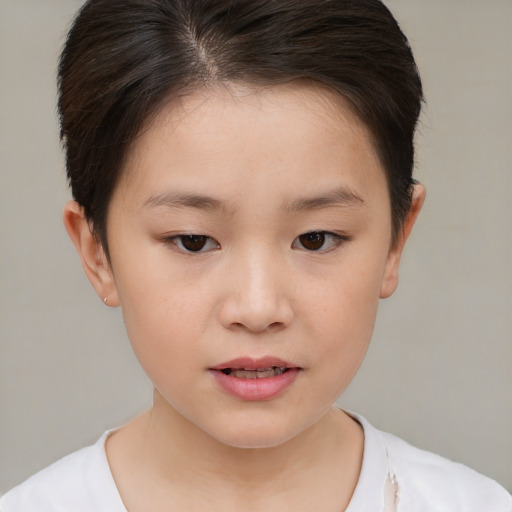 Joyful white child female with short  brown hair and brown eyes