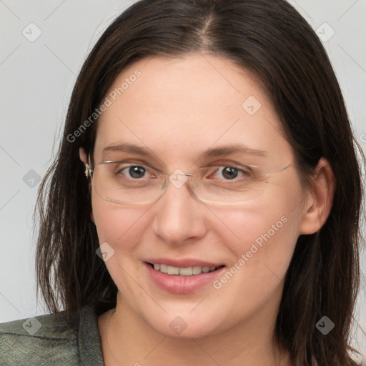 Joyful white adult female with long  brown hair and grey eyes