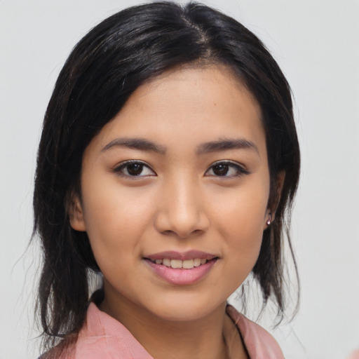 Joyful latino young-adult female with medium  black hair and brown eyes