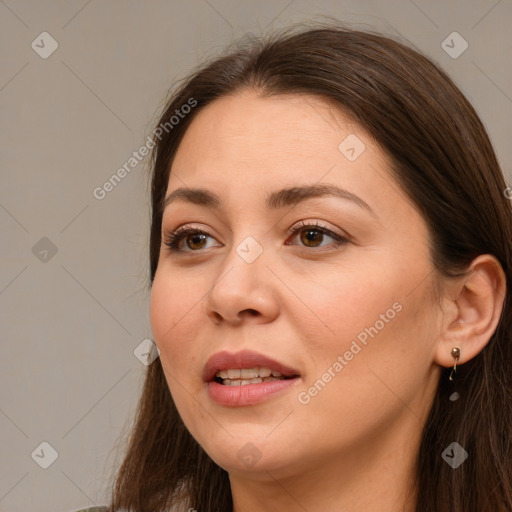 Joyful white young-adult female with long  brown hair and brown eyes