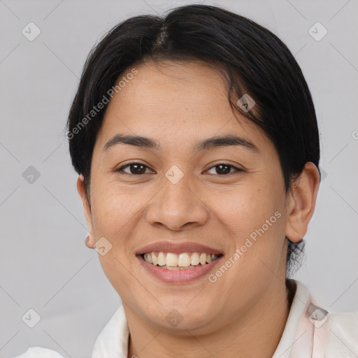 Joyful asian young-adult female with short  brown hair and brown eyes