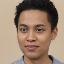 Joyful latino young-adult male with short  brown hair and brown eyes