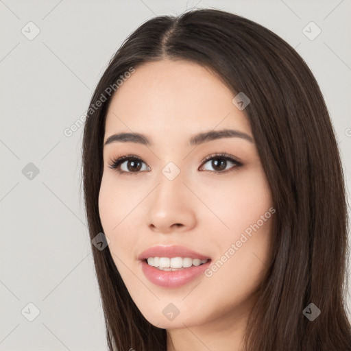 Joyful white young-adult female with long  black hair and brown eyes