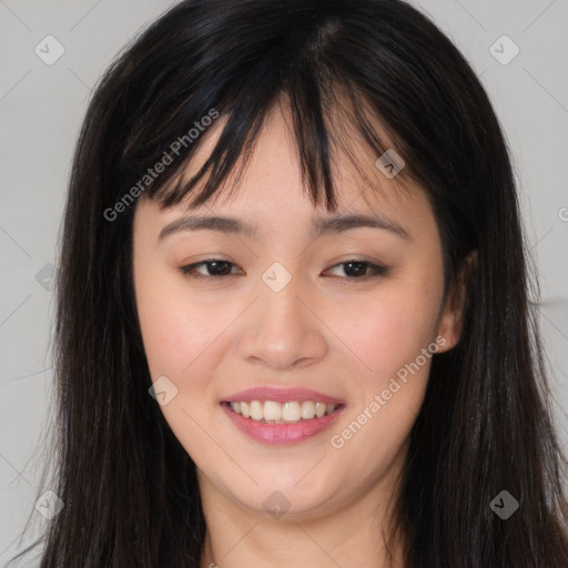 Joyful asian young-adult female with long  brown hair and brown eyes