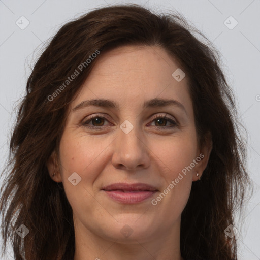 Joyful white adult female with long  brown hair and brown eyes