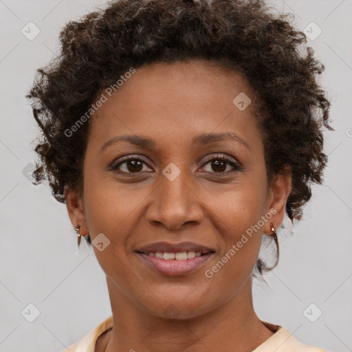 Joyful black young-adult female with short  brown hair and brown eyes