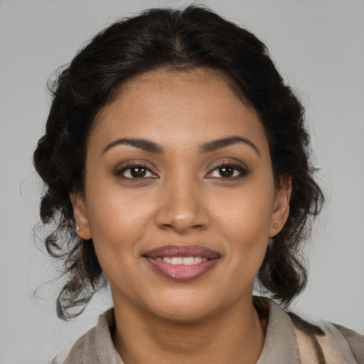 Joyful latino young-adult female with medium  brown hair and brown eyes