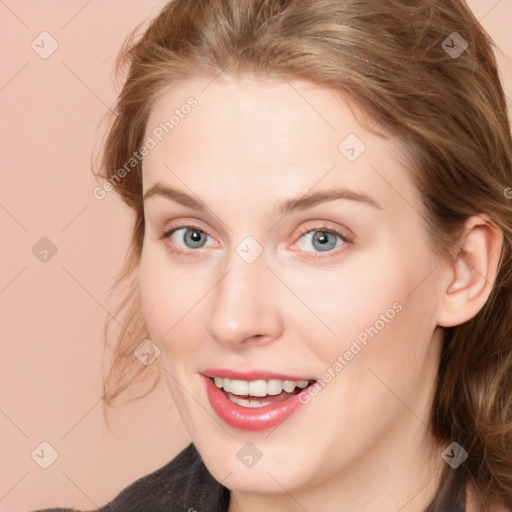 Joyful white young-adult female with long  brown hair and blue eyes