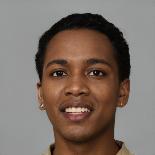 Joyful black young-adult female with short  black hair and brown eyes