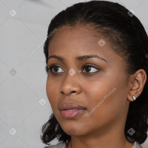 Neutral black young-adult female with medium  black hair and brown eyes