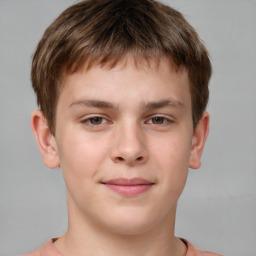 Joyful white child male with short  brown hair and brown eyes