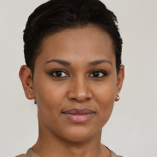 Joyful black young-adult female with short  brown hair and brown eyes