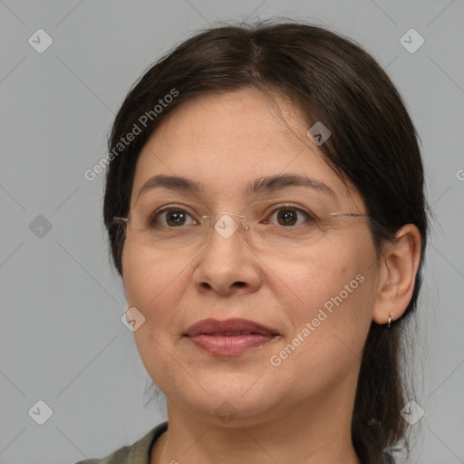 Joyful white adult female with medium  brown hair and brown eyes