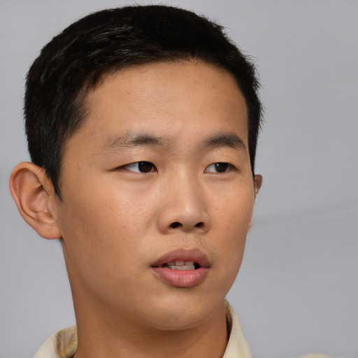 Neutral asian young-adult male with short  brown hair and brown eyes