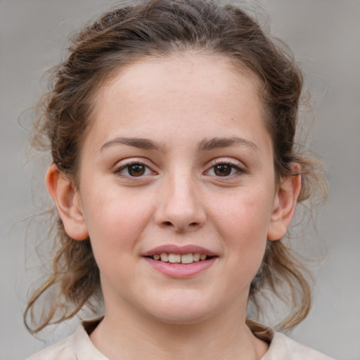 Joyful white child female with medium  brown hair and brown eyes