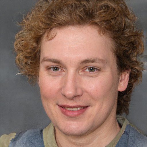 Joyful white adult female with medium  brown hair and blue eyes