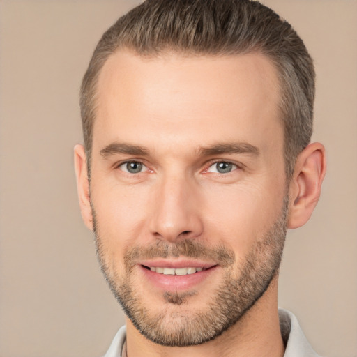 Joyful white adult male with short  brown hair and brown eyes