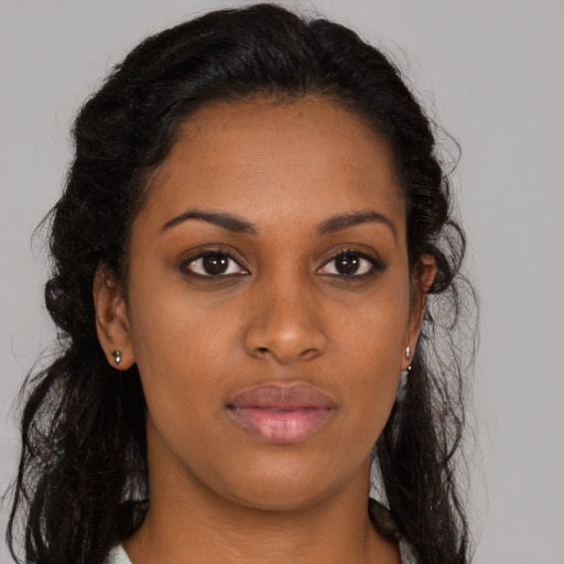 Neutral black young-adult female with long  brown hair and brown eyes