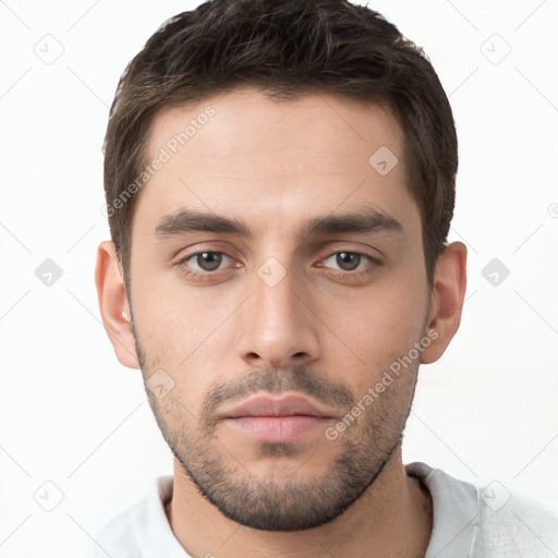 Neutral white young-adult male with short  brown hair and brown eyes