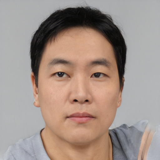 Neutral asian young-adult male with short  black hair and brown eyes