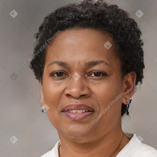 Joyful black adult female with short  brown hair and brown eyes