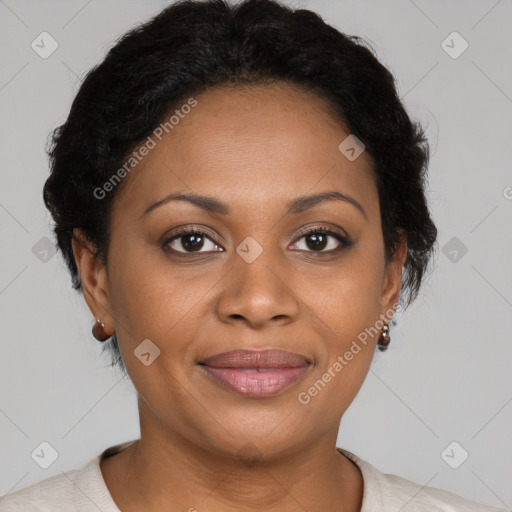 Joyful black adult female with short  brown hair and brown eyes