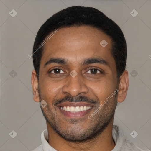 Joyful latino young-adult male with short  black hair and brown eyes