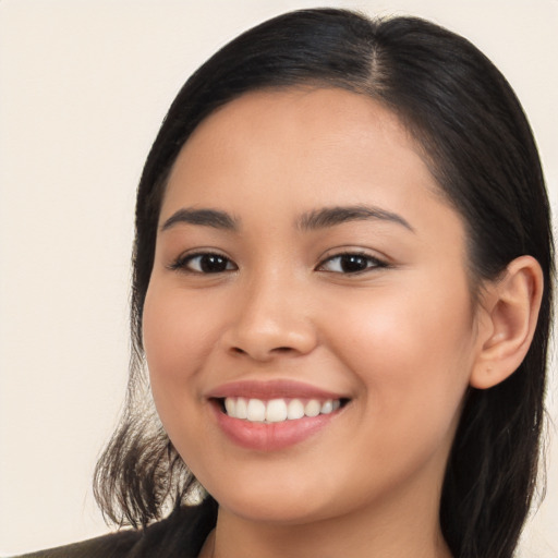 Joyful white young-adult female with long  brown hair and brown eyes