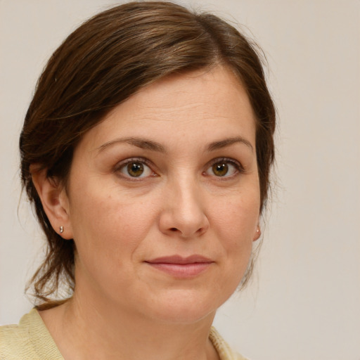 Joyful white adult female with medium  brown hair and brown eyes