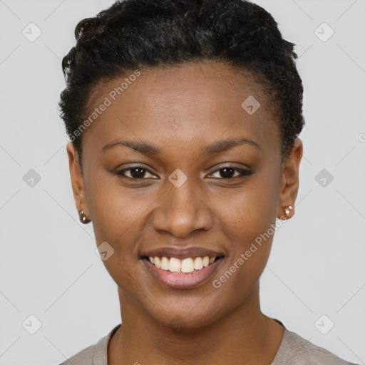 Joyful black young-adult female with short  brown hair and brown eyes