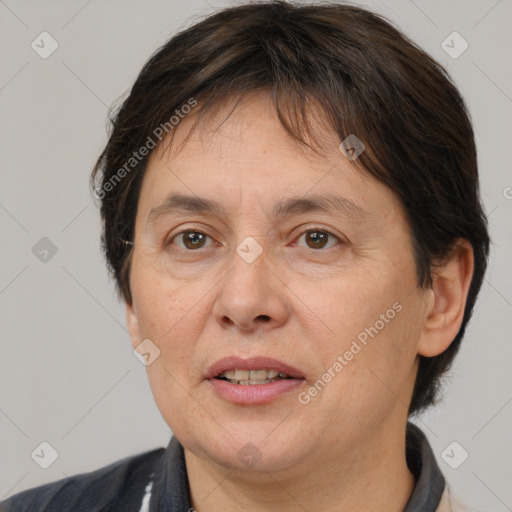 Joyful white adult female with medium  brown hair and brown eyes