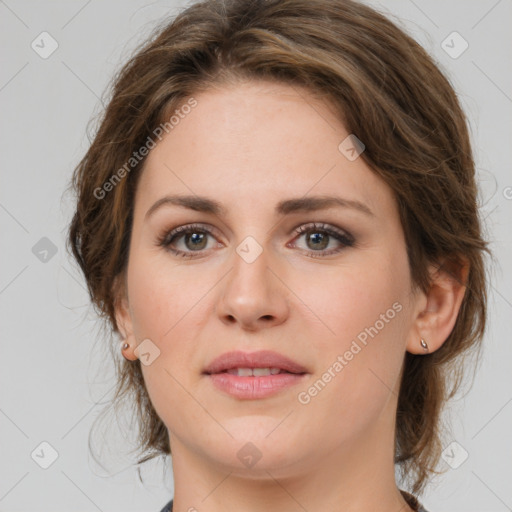 Joyful white young-adult female with medium  brown hair and green eyes