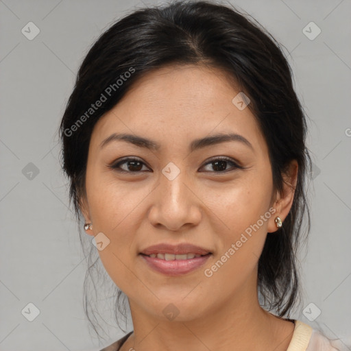 Joyful latino young-adult female with medium  brown hair and brown eyes