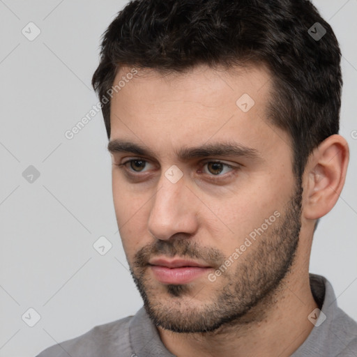 Neutral white young-adult male with short  black hair and brown eyes