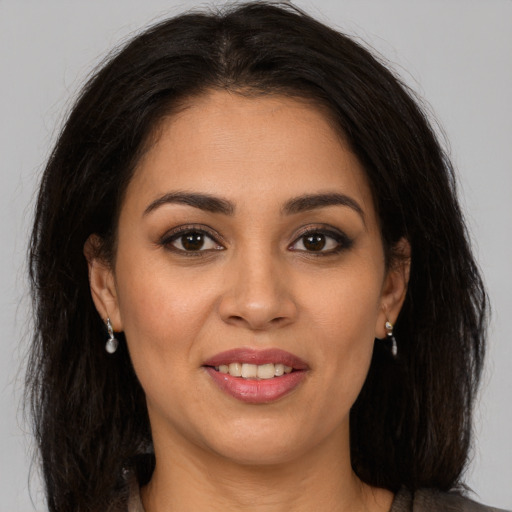 Joyful white young-adult female with long  brown hair and brown eyes