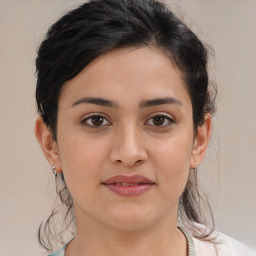 Joyful white young-adult female with medium  brown hair and brown eyes