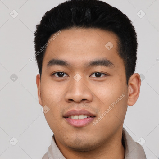 Joyful asian young-adult male with short  black hair and brown eyes