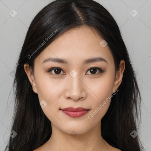 Joyful asian young-adult female with long  brown hair and brown eyes