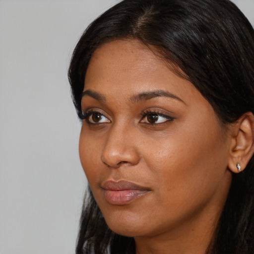 Neutral black young-adult female with long  black hair and brown eyes