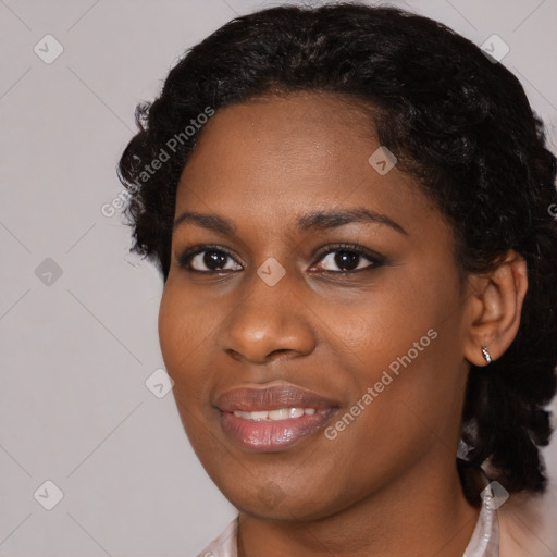 Joyful black young-adult female with medium  black hair and brown eyes