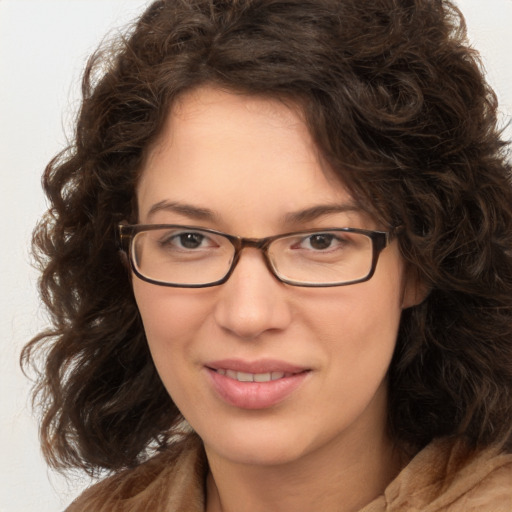 Joyful white young-adult female with medium  brown hair and green eyes