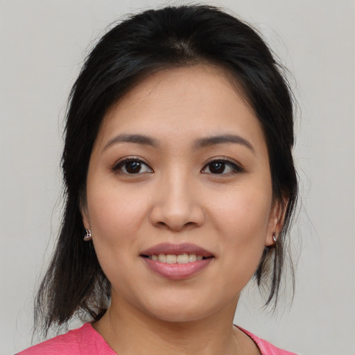 Joyful asian young-adult female with medium  brown hair and brown eyes