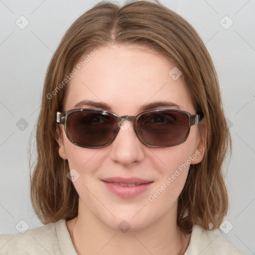 Joyful white young-adult female with medium  brown hair and blue eyes