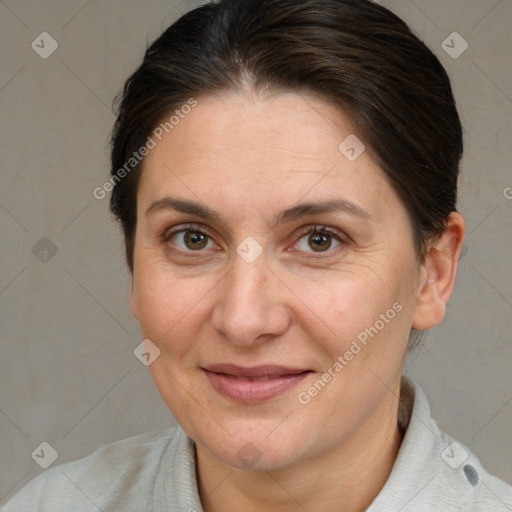 Joyful white adult female with short  brown hair and brown eyes