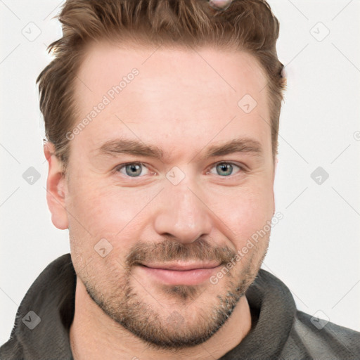 Joyful white adult male with short  brown hair and grey eyes