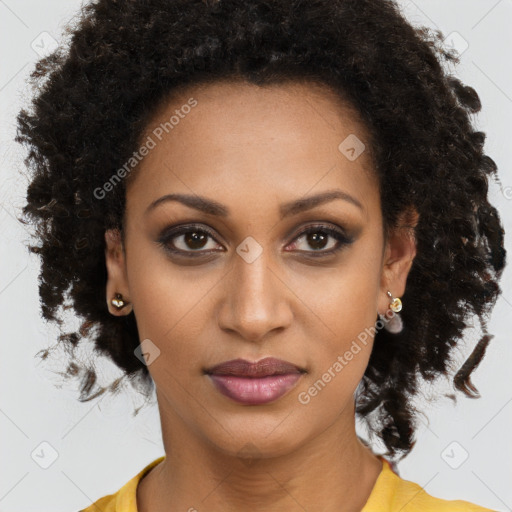 Joyful black young-adult female with long  brown hair and brown eyes