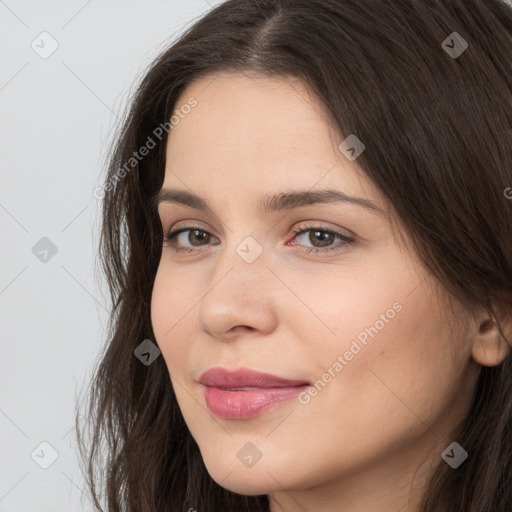 Neutral white young-adult female with long  brown hair and brown eyes