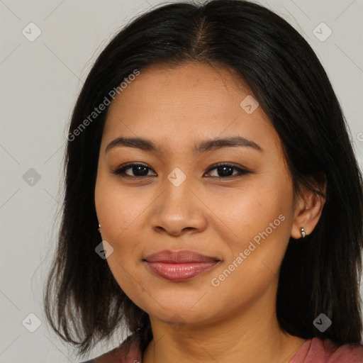 Joyful asian young-adult female with long  brown hair and brown eyes