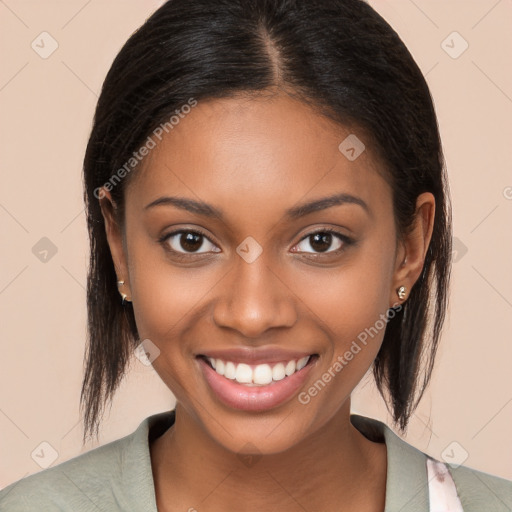 Joyful black young-adult female with long  brown hair and brown eyes